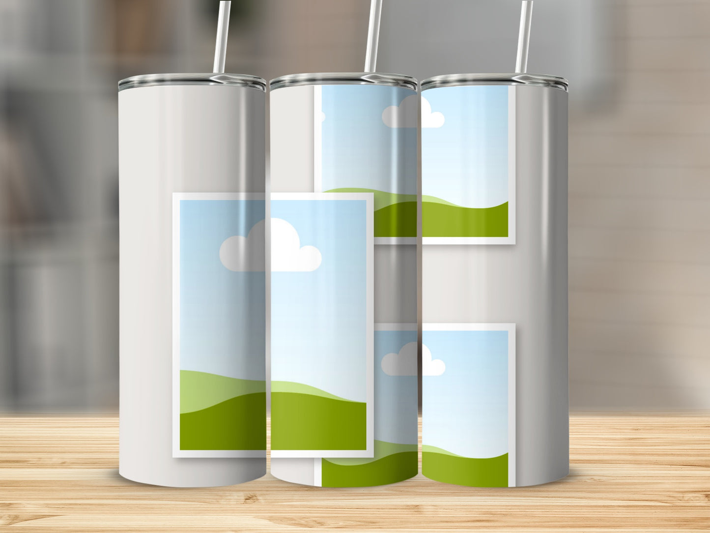 Three white tumblers with straws, each displaying placeholder images of sky and rolling green hills.
