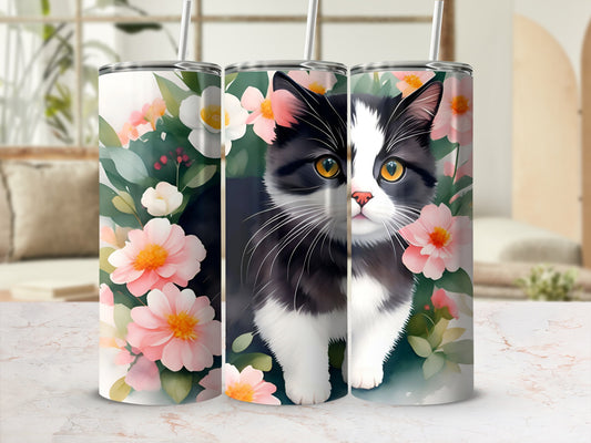 Black and white cat with pink flowers on a tumbler.