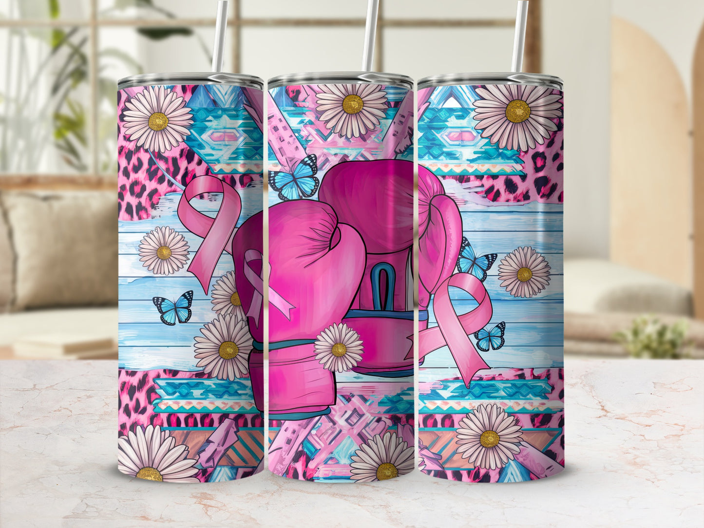 Pink boxing gloves with butterflies and floral pattern on a tumbler.