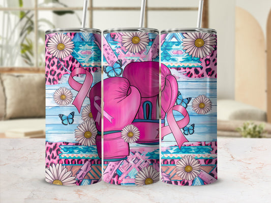 Pink boxing gloves with butterflies and floral pattern on a tumbler.