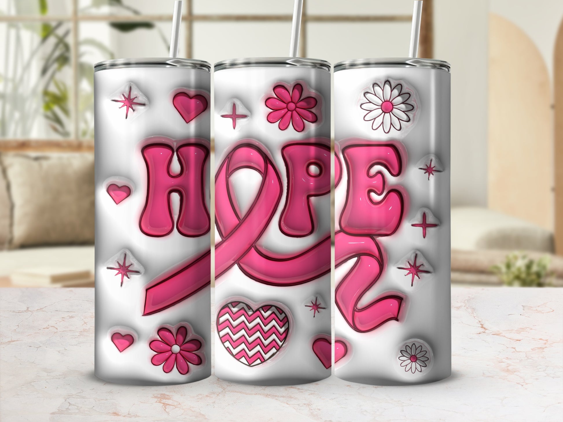 Pink "HOPE" text and ribbon on three tumblers with hearts and flowers.