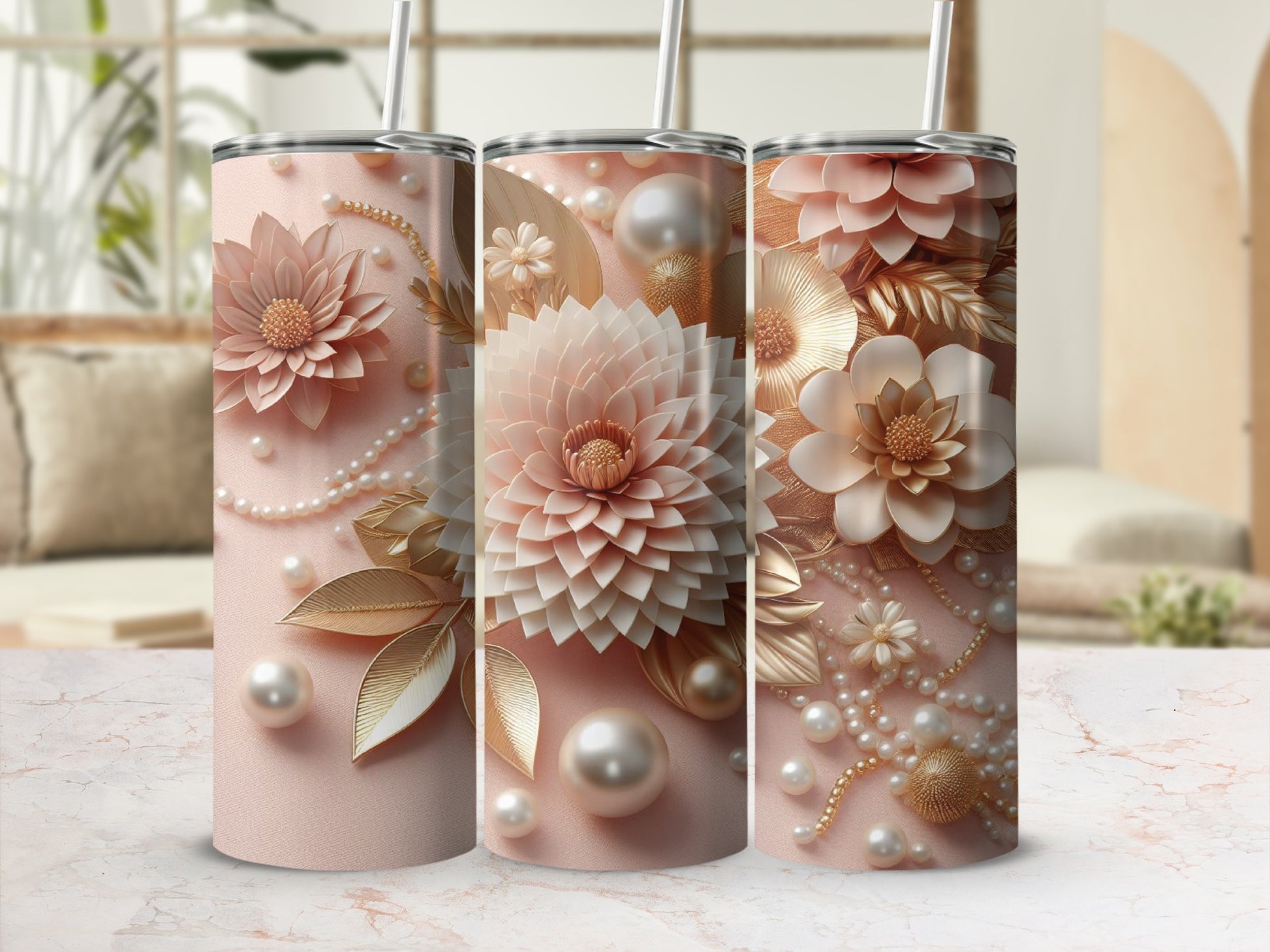 Three pink tumblers with floral and pearl embellishments.