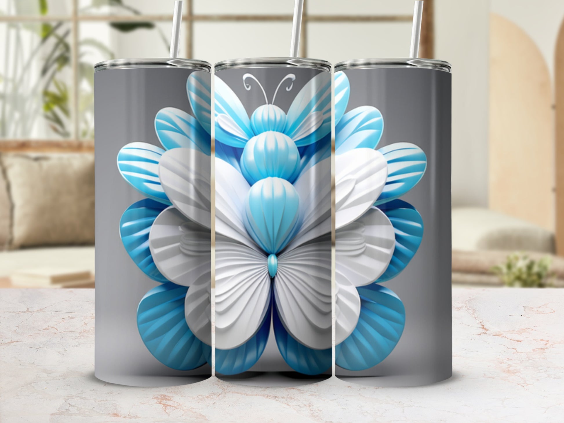Butterfly floral pattern on three tumblers with straws.
