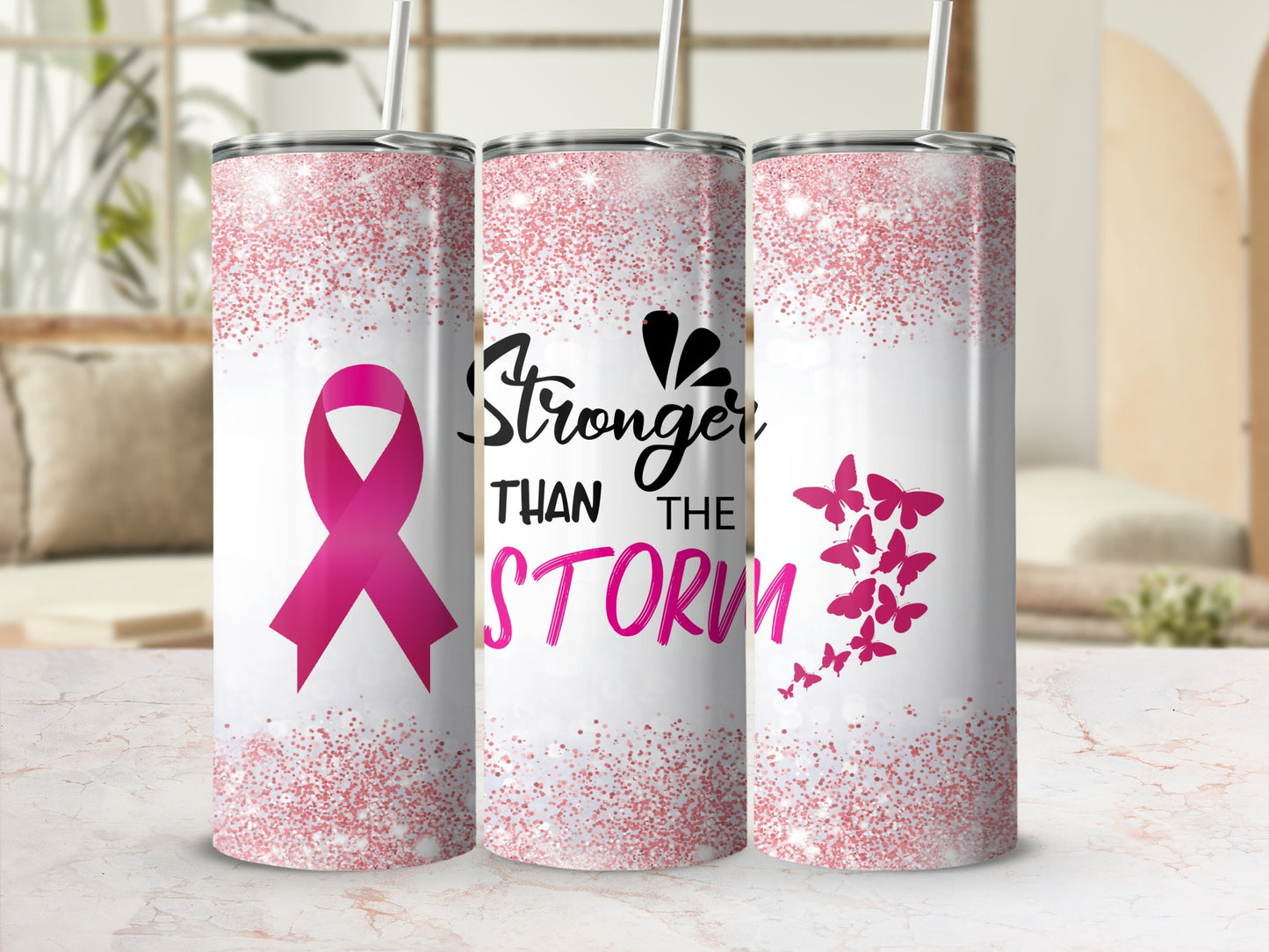 Pink ribbon and butterflies on a tumbler, reading "Stronger Than The Storm."