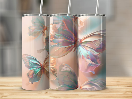 Three tumblers with iridescent butterfly wings on a light background.