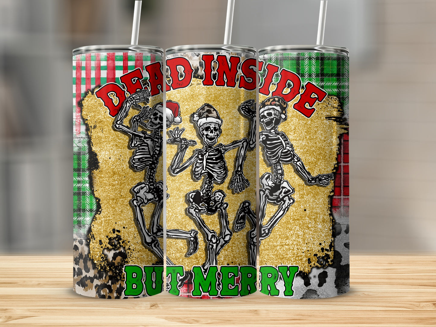 Three tumblers with dancing skeletons and "DEAD INSIDE BUT MERRY" text.