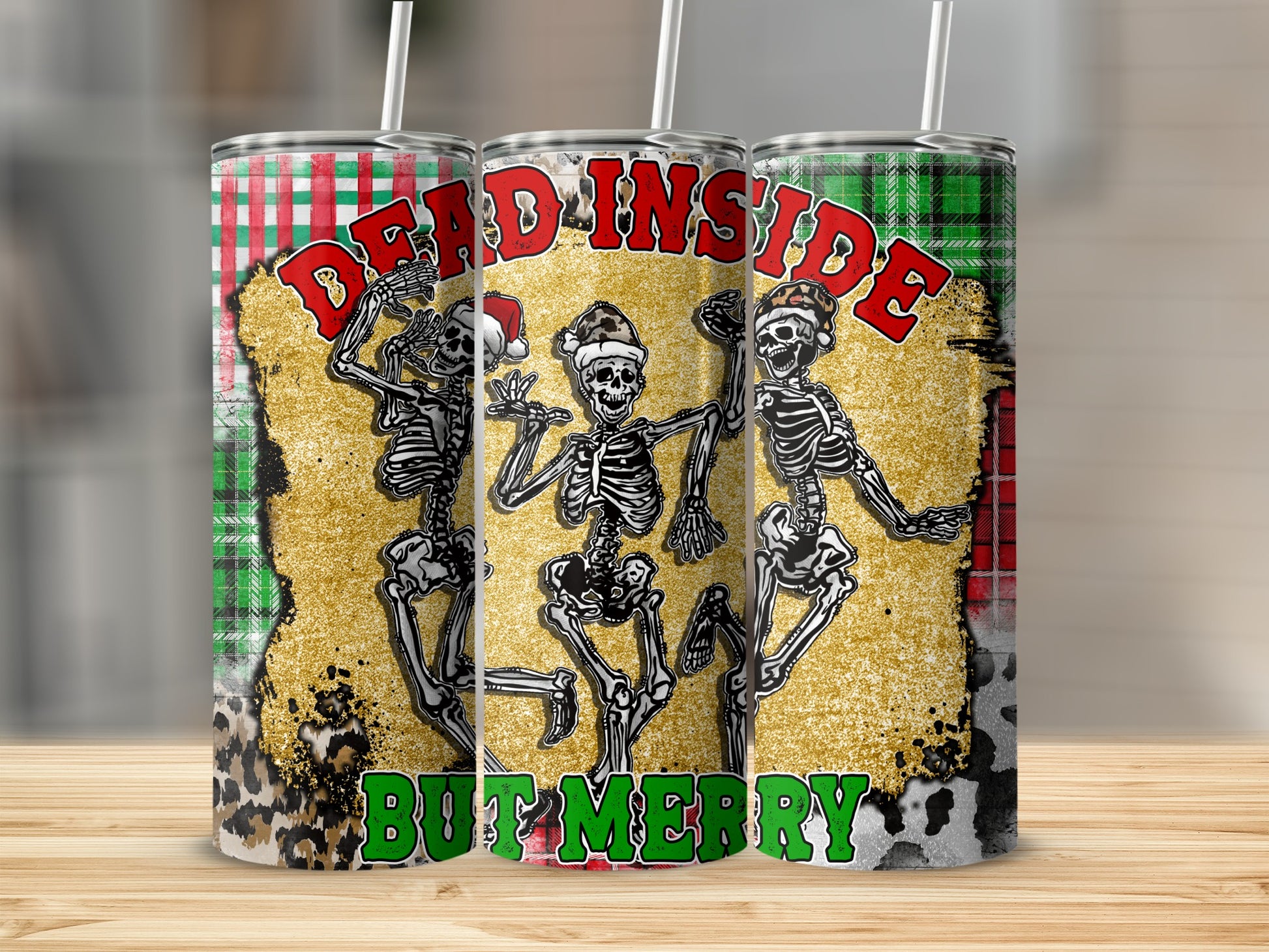 Three tumblers with dancing skeletons and "DEAD INSIDE BUT MERRY" text.