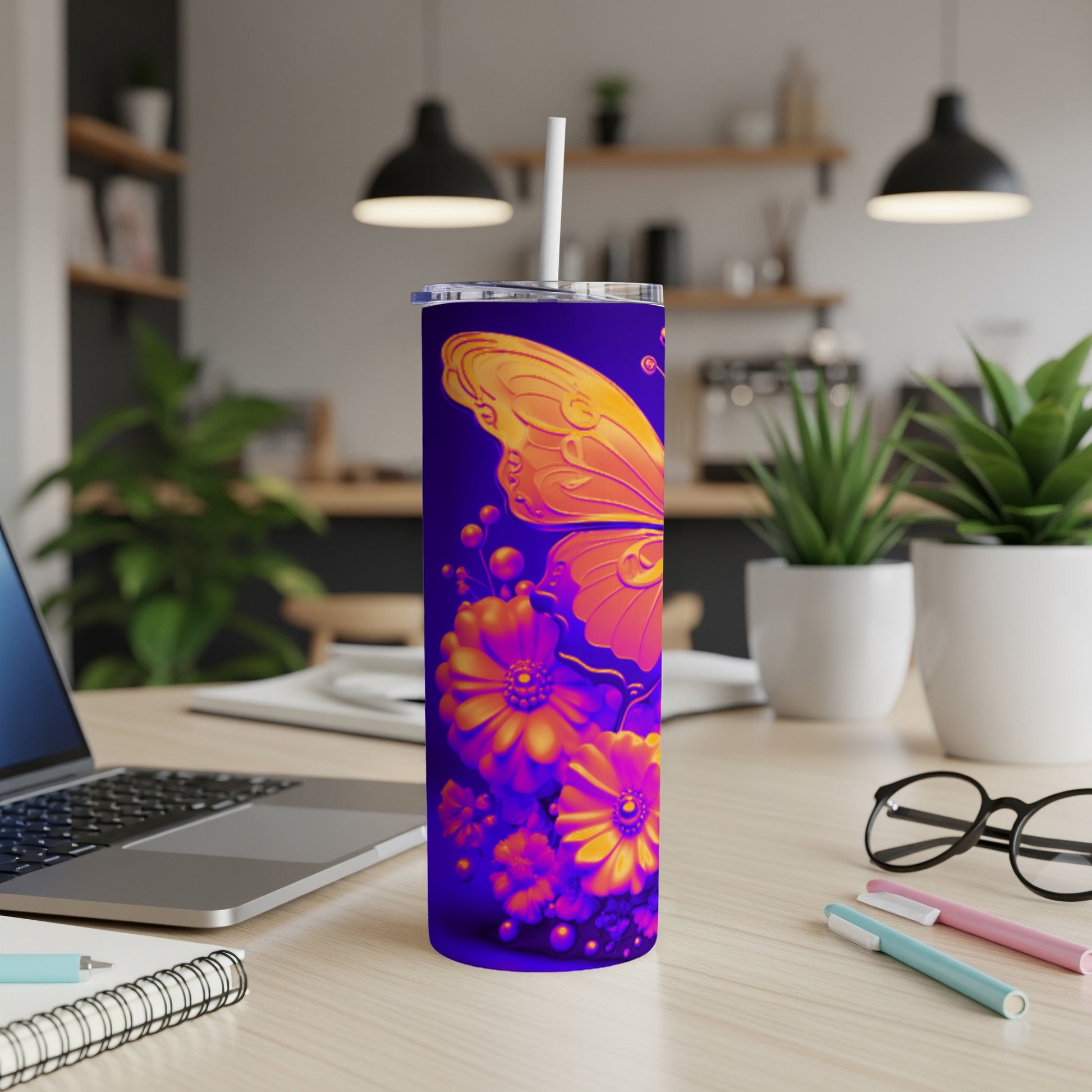 Purple tumbler with an orange butterfly and floral design.