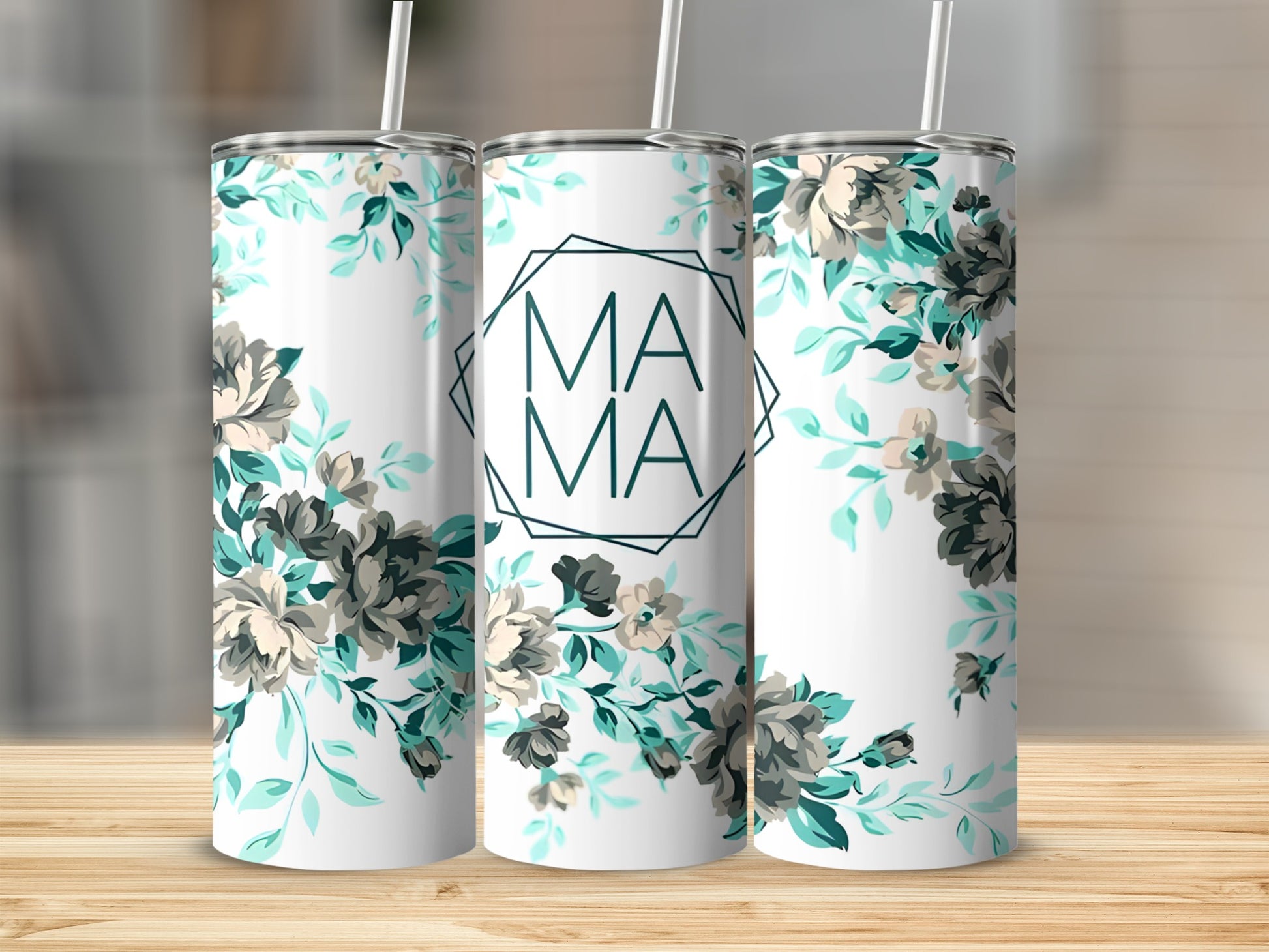 White tumbler with floral design and "MAMA" in geometric frame.