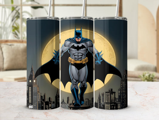 Batman stands on a city skyline with a full moon behind him.