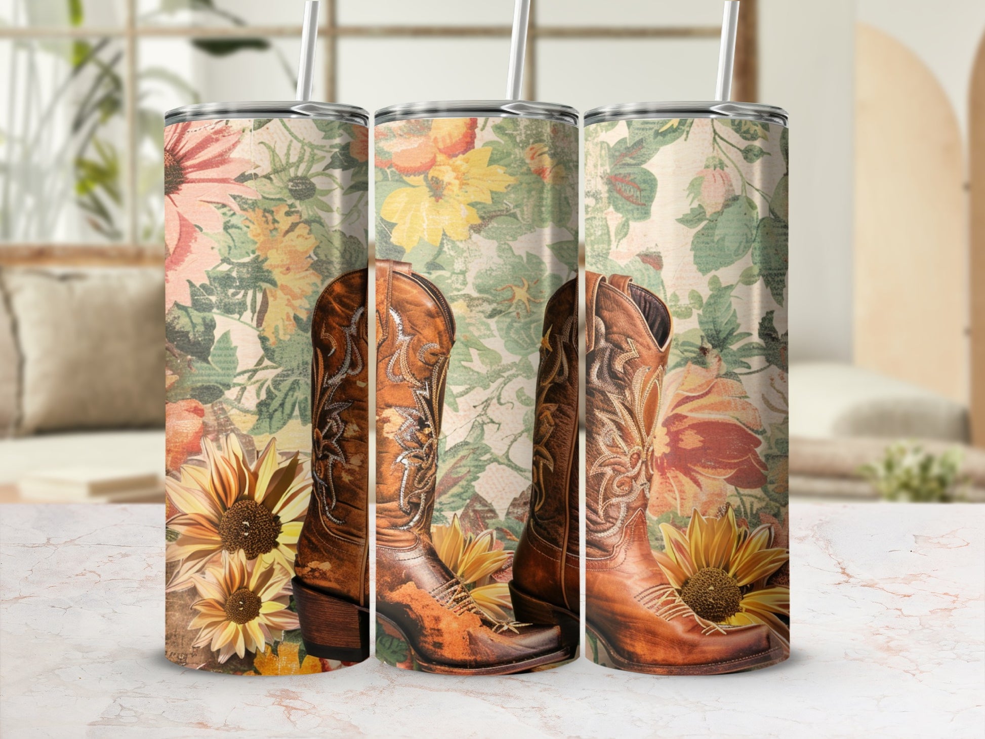 Brown cowboy boots with floral pattern on a marbled surface.