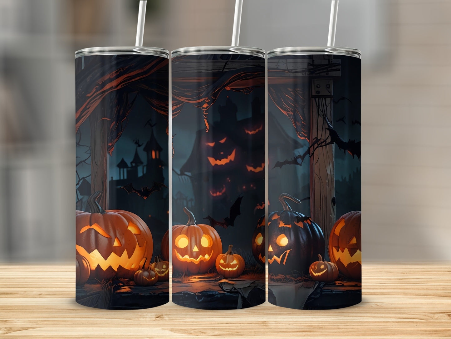 Tumblers with a Halloween scene featuring jack-o'-lanterns and bats.