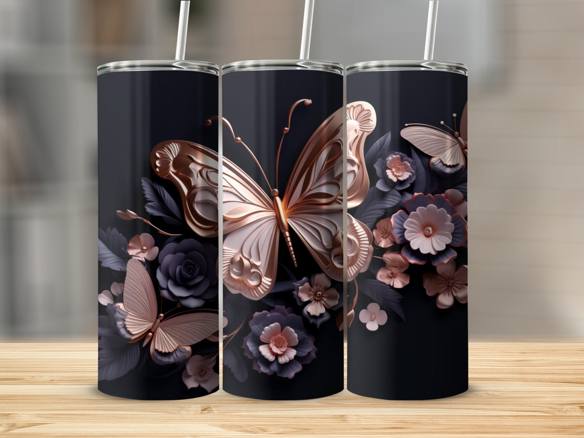 Triptych of dark tumblers featuring intricate rose gold butterflies and floral designs.