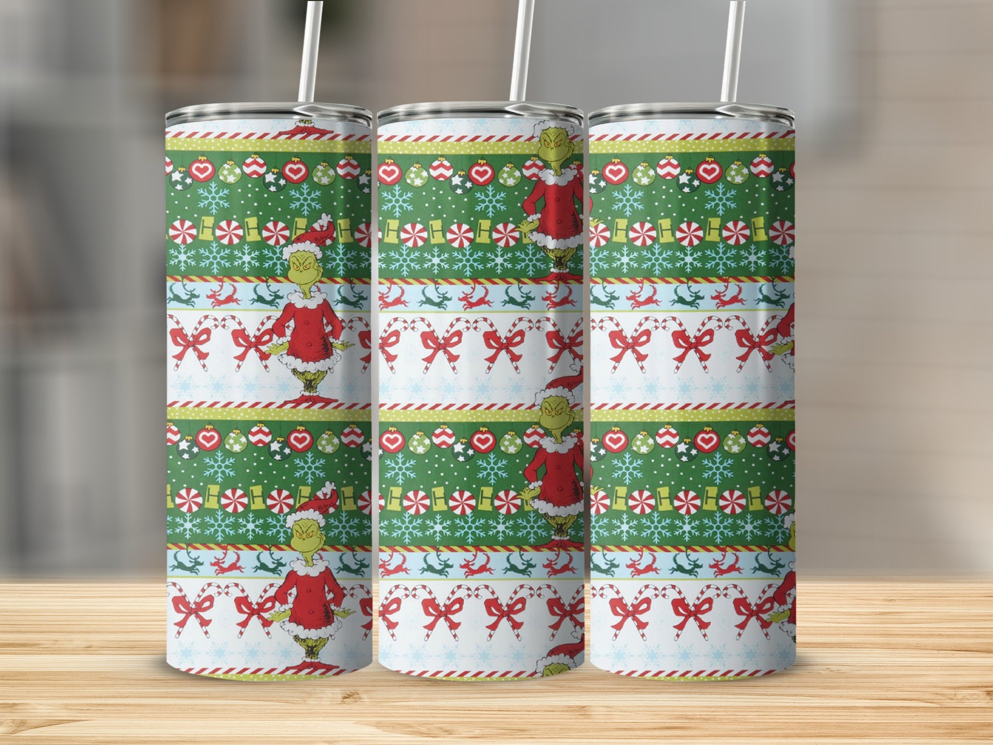 Christmas tumbler with Grinch, snowflakes, candy canes, and reindeer pattern.