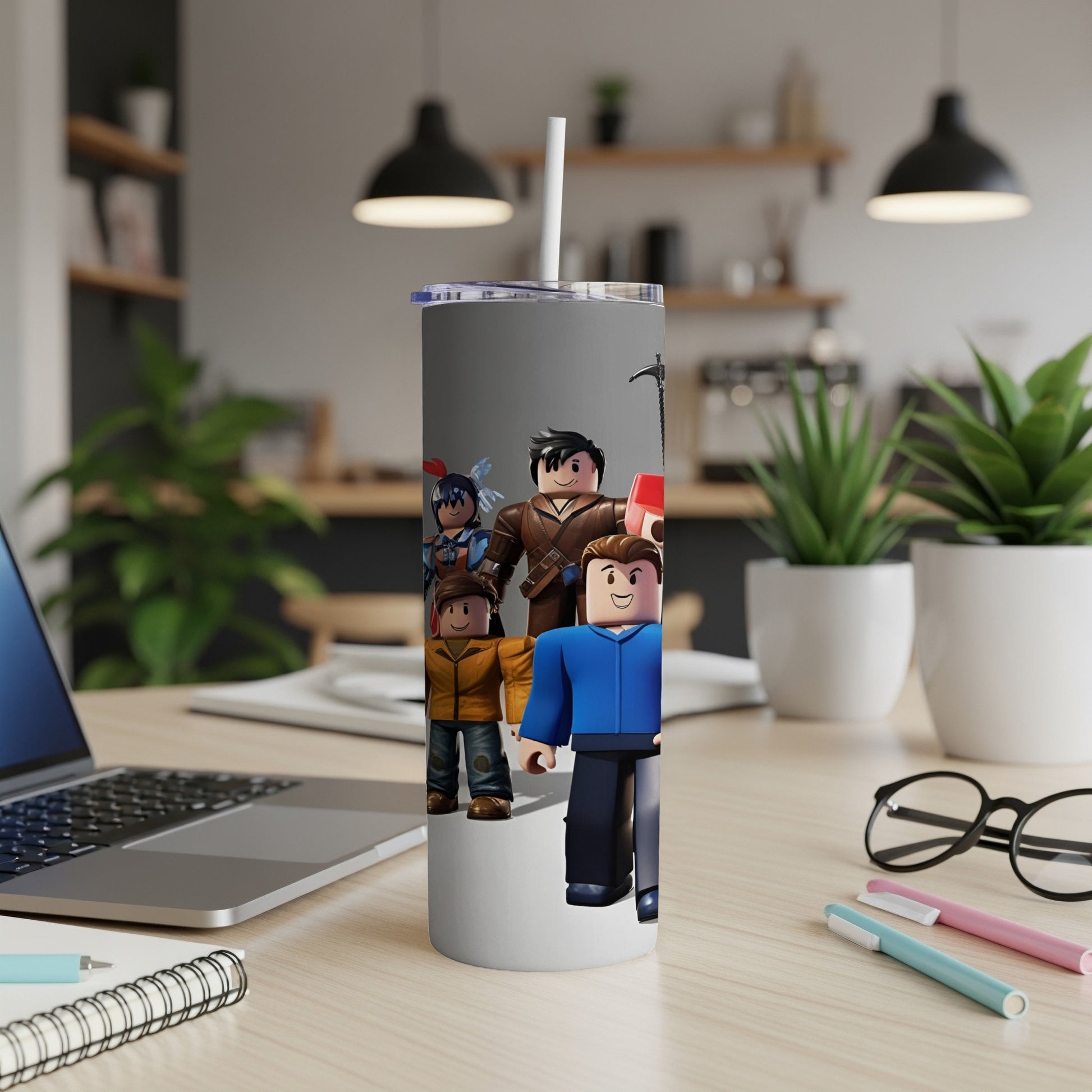 Roblox characters on a tumbler with a laptop and office supplies.