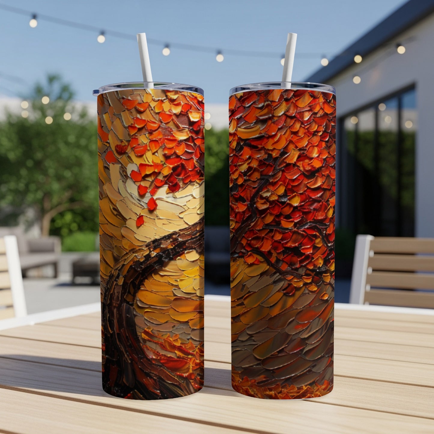 Two tumblers featuring a textured, impasto painting of a tree with fiery orange and red leaves.