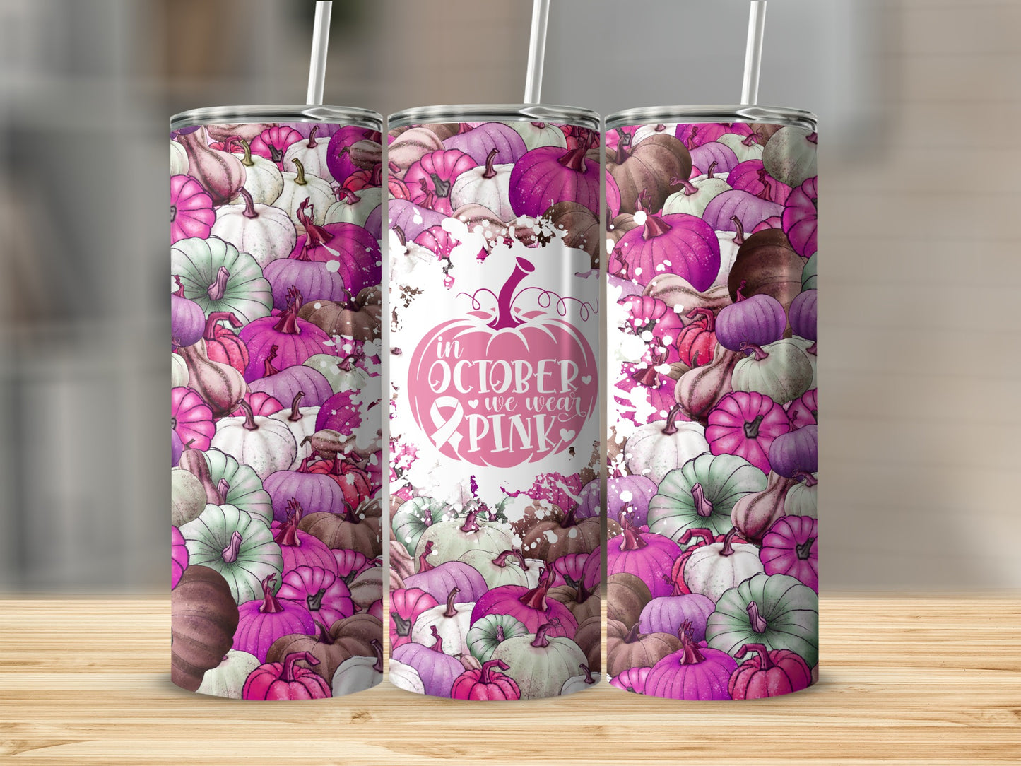 Tumbler with pink and green pumpkins and "In October We Wear Pink" text.