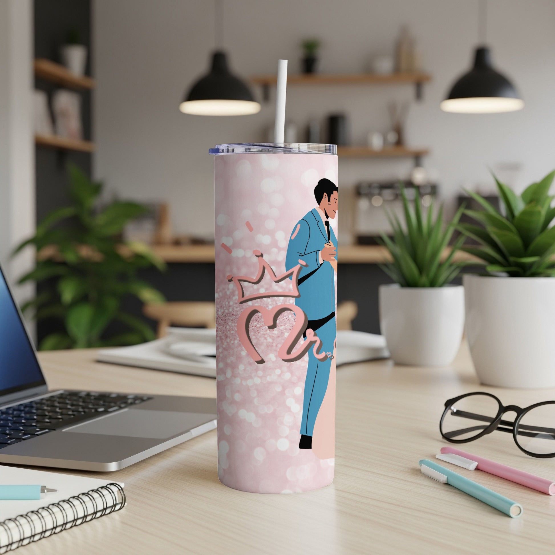 Pink tumbler with bride and groom graphic, crown, and polka dots.