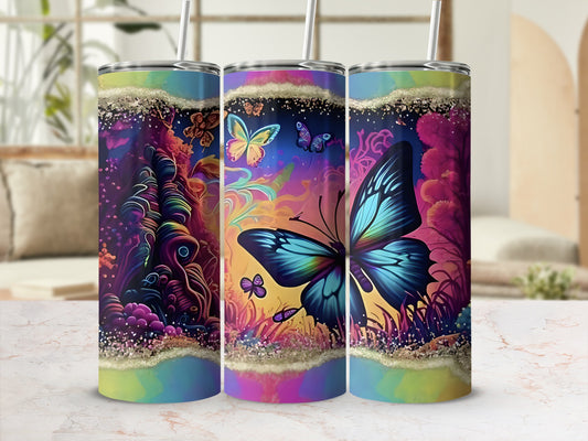 Three tumblers with colorful butterfly and abstract floral designs.