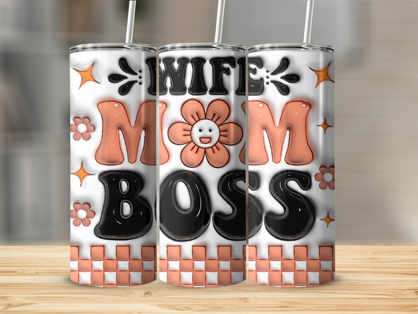 Tumbler with "Wife Mom Boss" text, floral, and star graphics.
