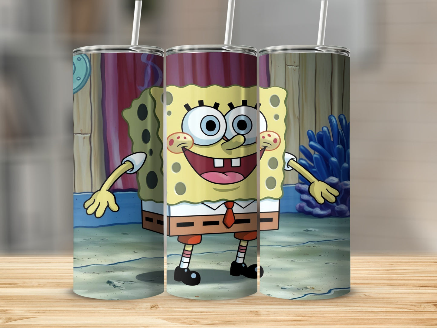 SpongeBob SquarePants character on a patterned tumbler with a straw.