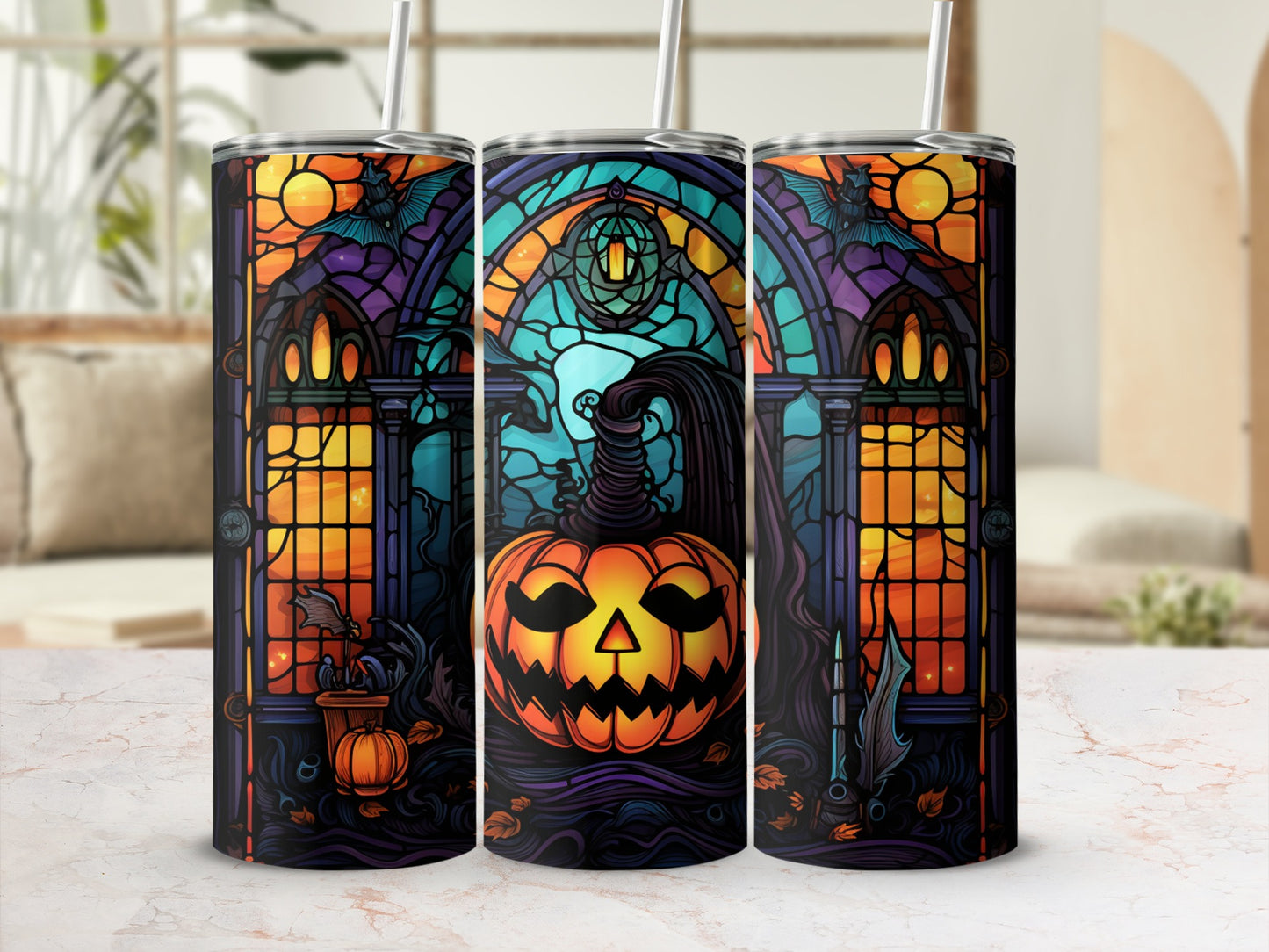 Three Halloween-themed tumblers with stained-glass pumpkin and bat designs.