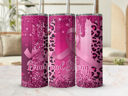 Pink leopard print tumbler with glitter drip and "Brave and Strong" text.