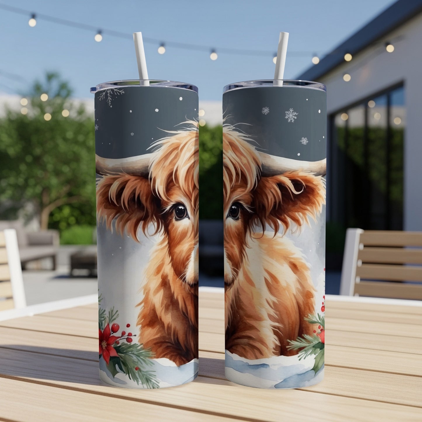 Fluffy Highland cow artwork with snowflakes and holly on a tumbler.