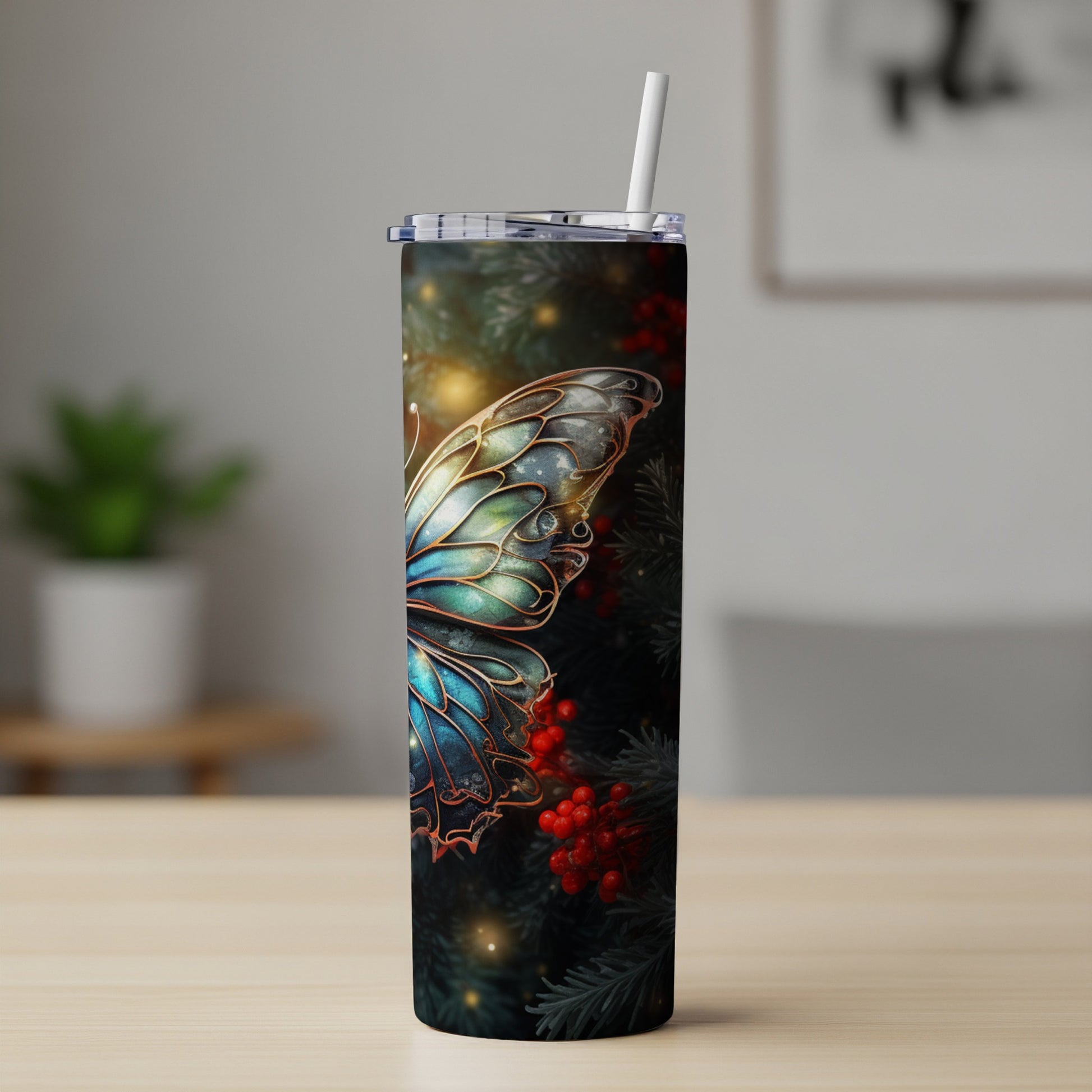 Tall tumbler with iridescent butterfly wings and red berries on dark background.