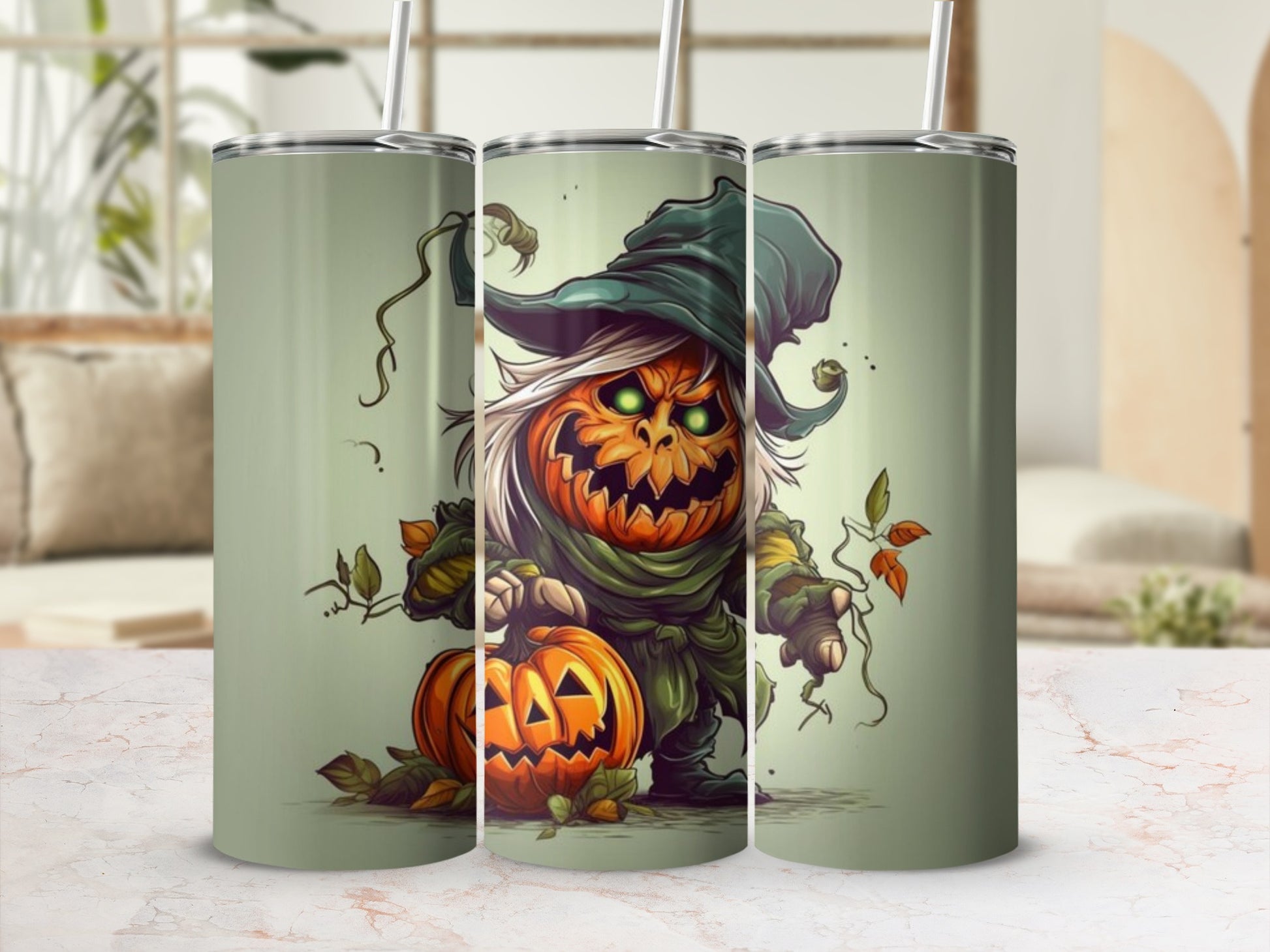 Three tumblers with a spooky jack-o'-lantern character and autumn leaves design.