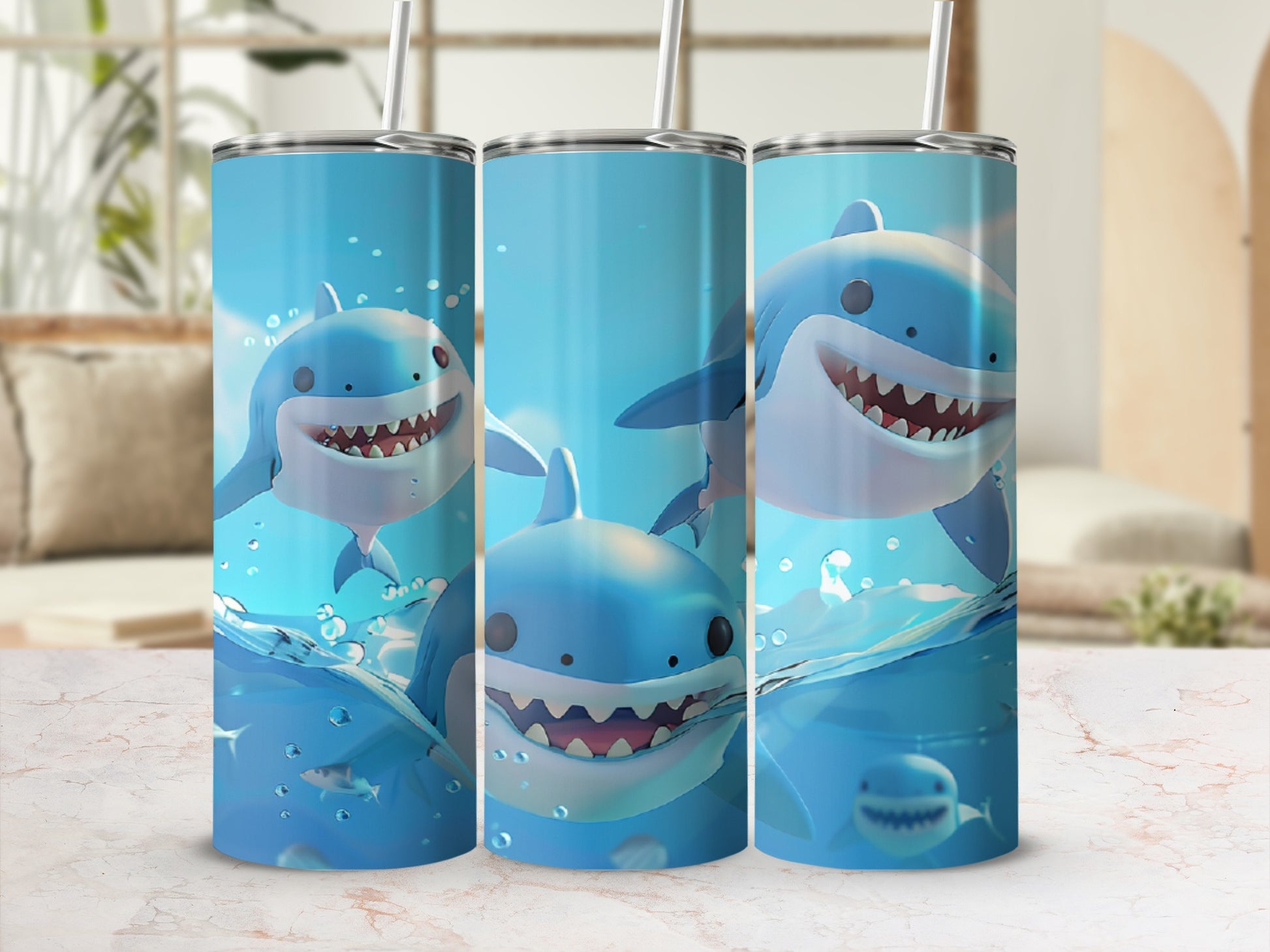 Three tumblers featuring cartoon sharks swimming in water.