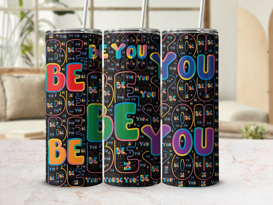 Three tumblers with a repeating "BE YOU" text pattern in colorful block letters.