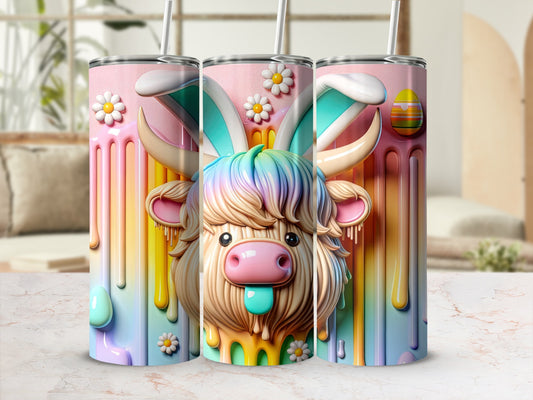 Highland cow with bunny ears and colorful dripping design on tumbler.