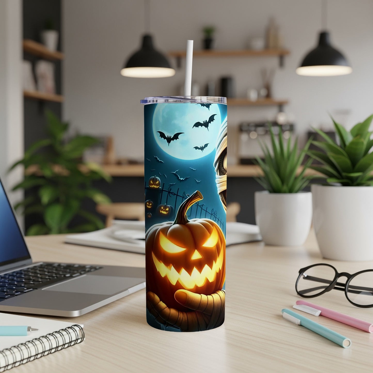 Tumbler with glowing jack-o'-lantern and mummy design under a full moon with bats.