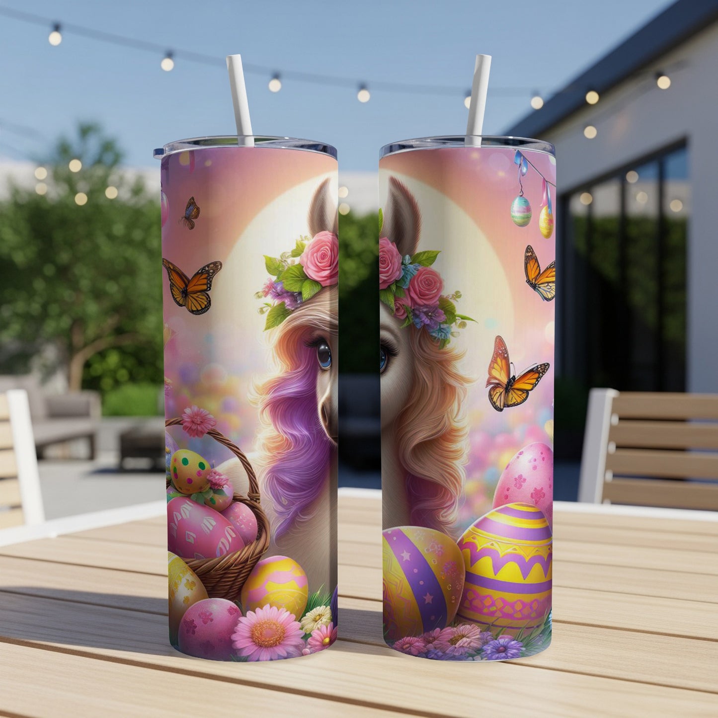 Easter tumbler with llama, eggs, and butterflies on a table.