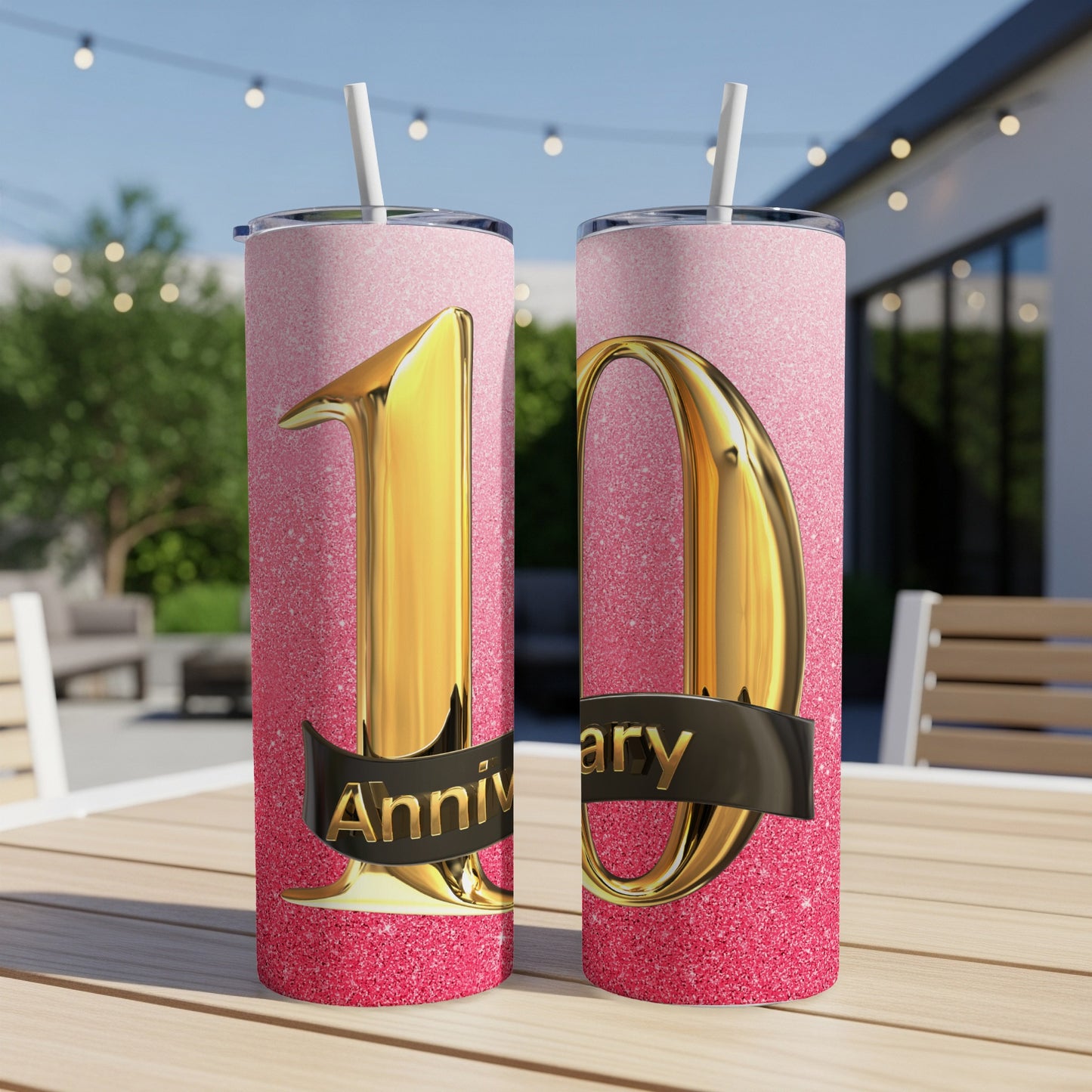 Two tall tumblers with gold "10" and "anniversary" text on pink glitter.