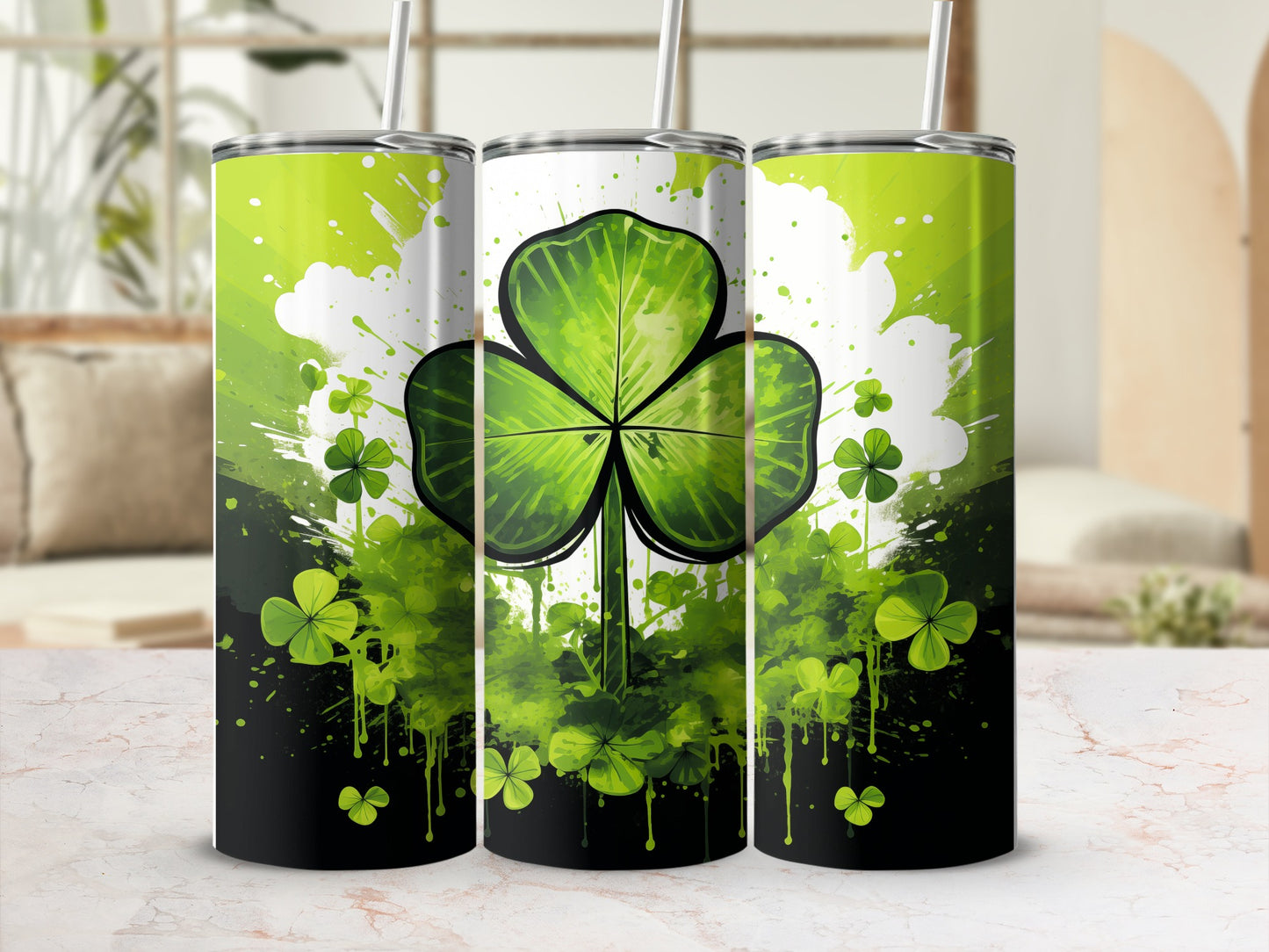 Three tumblers with shamrock and splatter paint design.