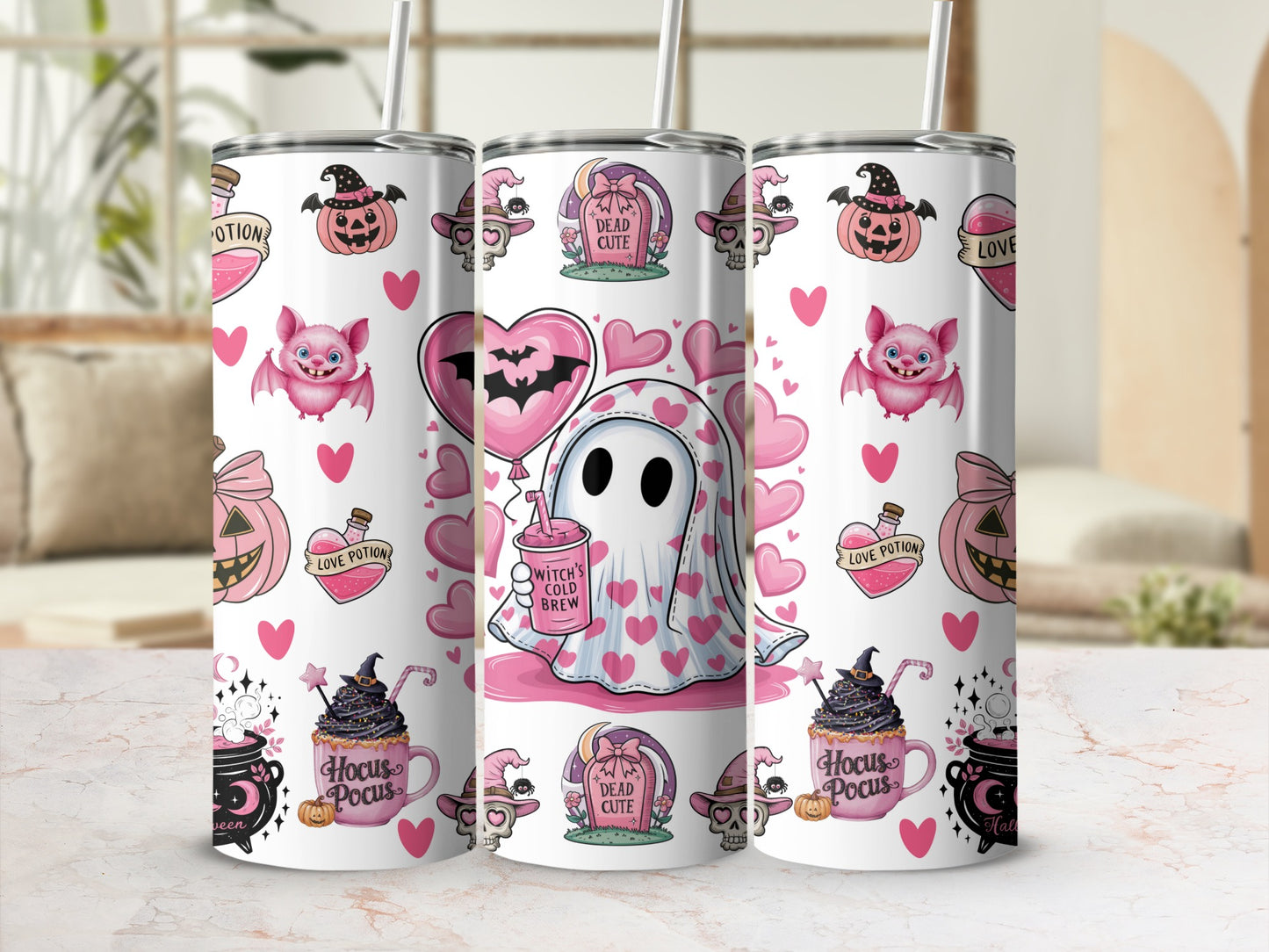 Three tumblers with a pink and white Halloween-themed design featuring ghosts, bats, and pumpkins.