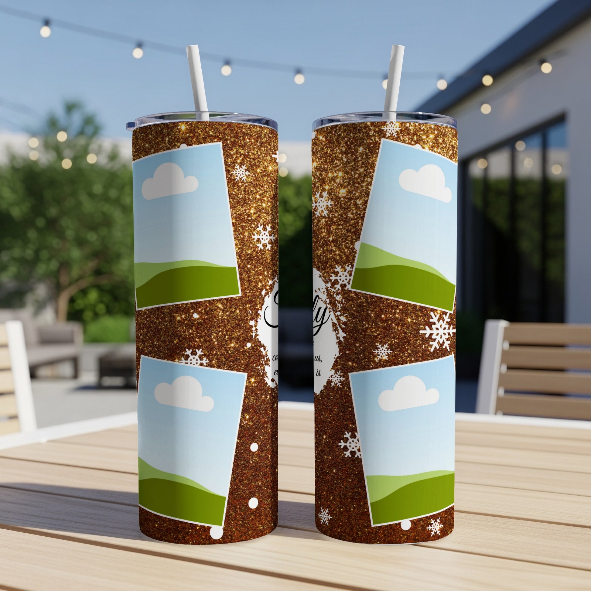Two glitter tumblers with photo frames, clouds, and snowflakes, on a table.