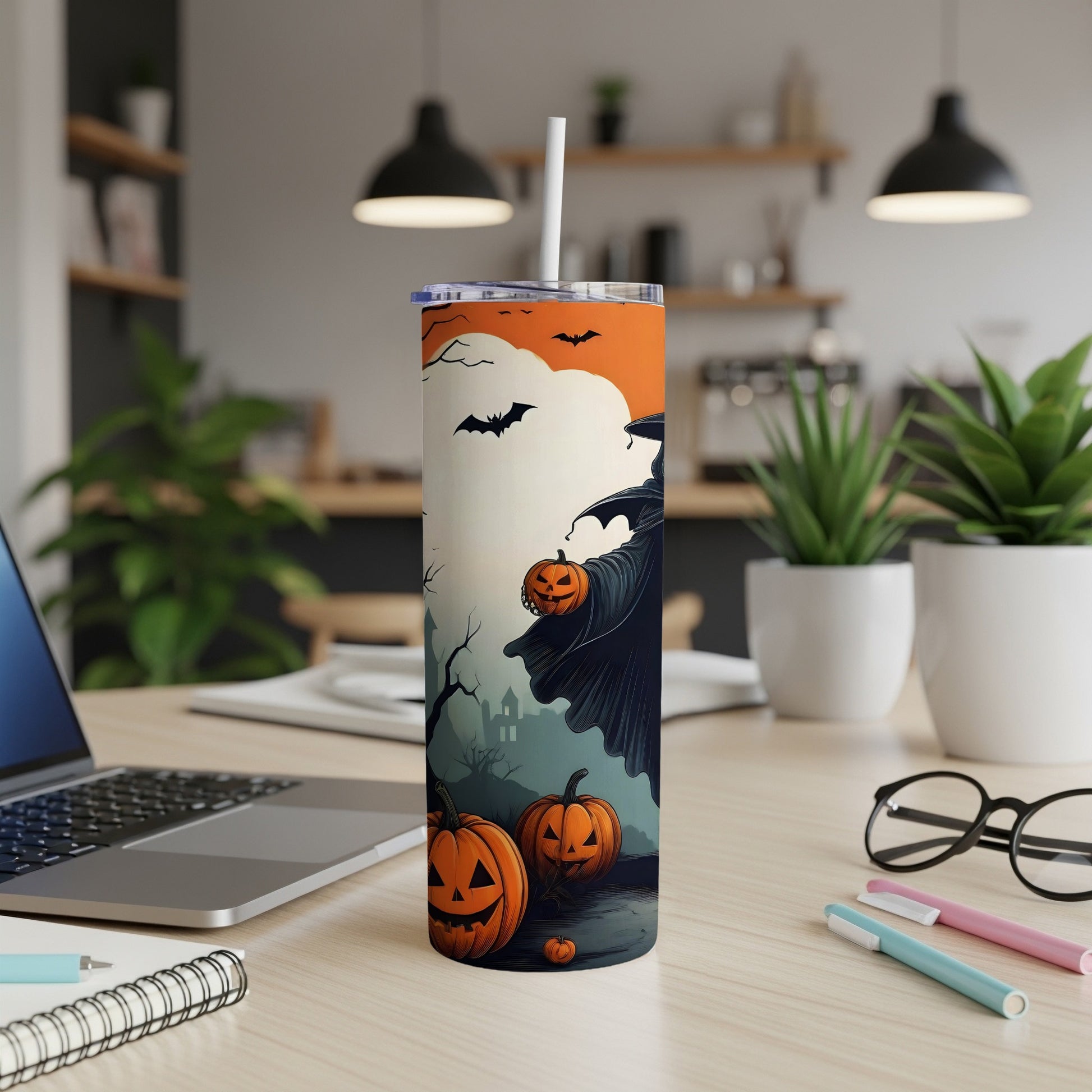 Halloween tumbler with a witch and pumpkins design.