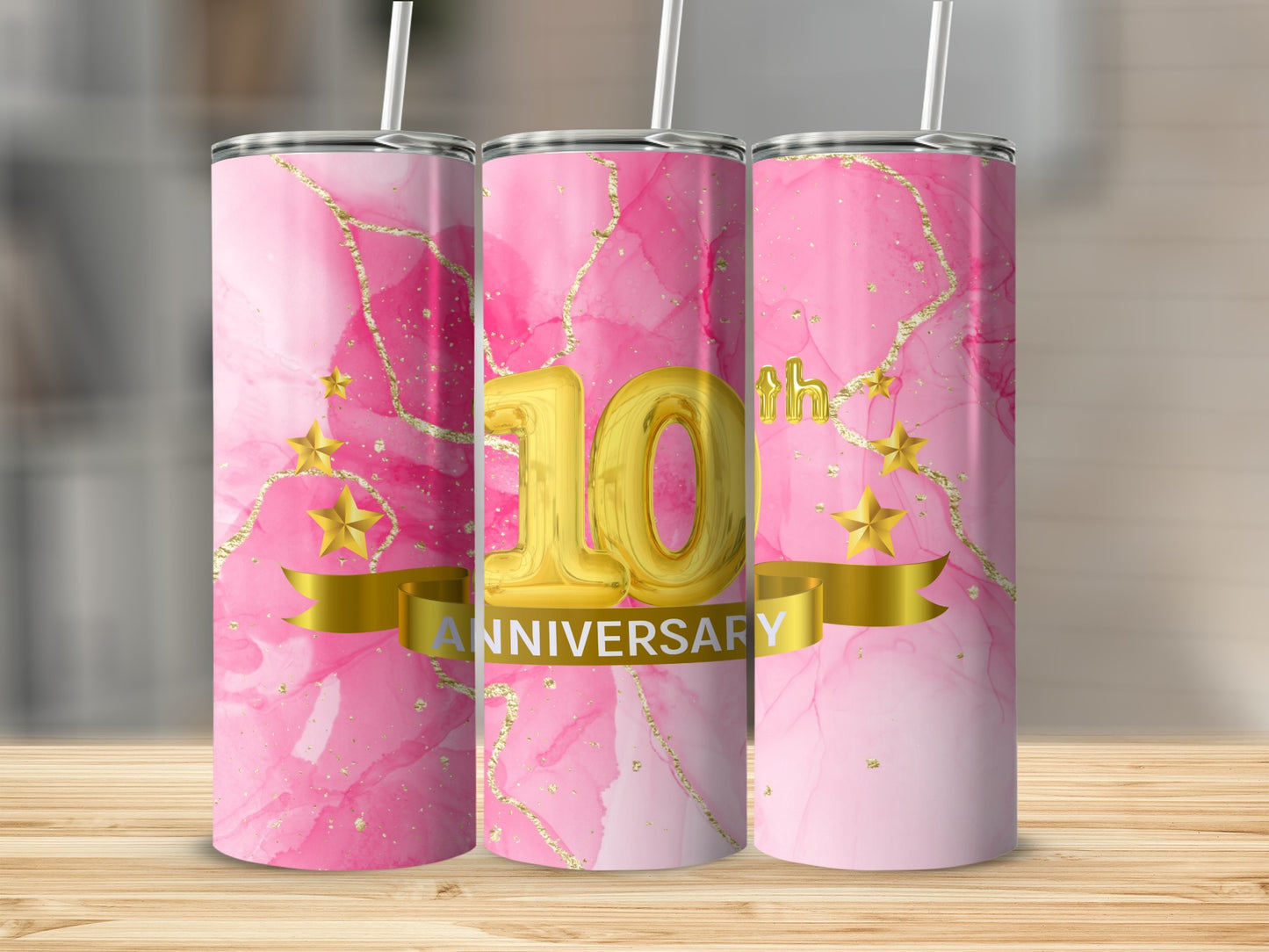 Pink marble tumbler with gold stars and "10th Anniversary" text.