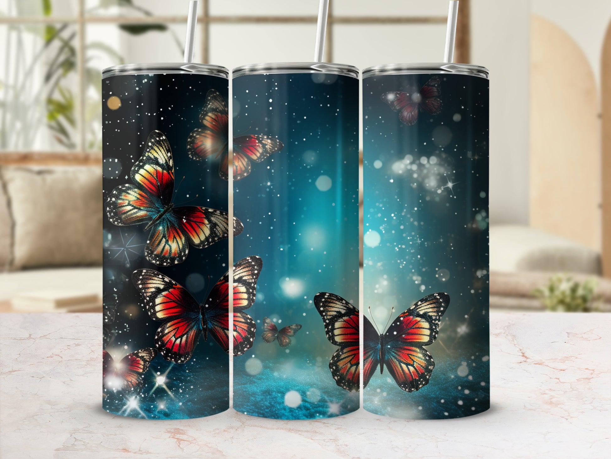 Three tumblers with colorful butterflies and sparkling light effects.