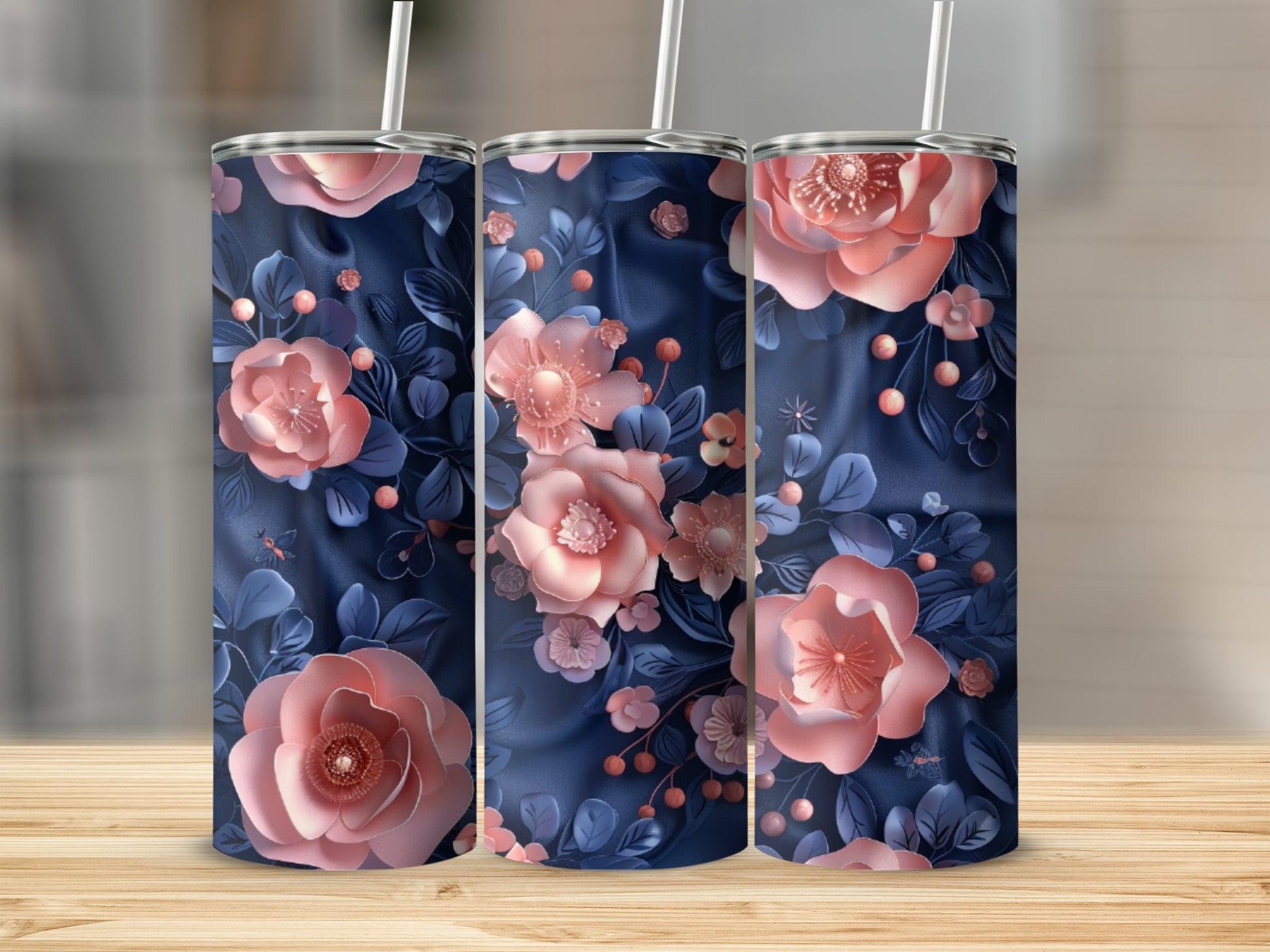 Three tumblers with a navy floral design, featuring pink flowers and leaves.