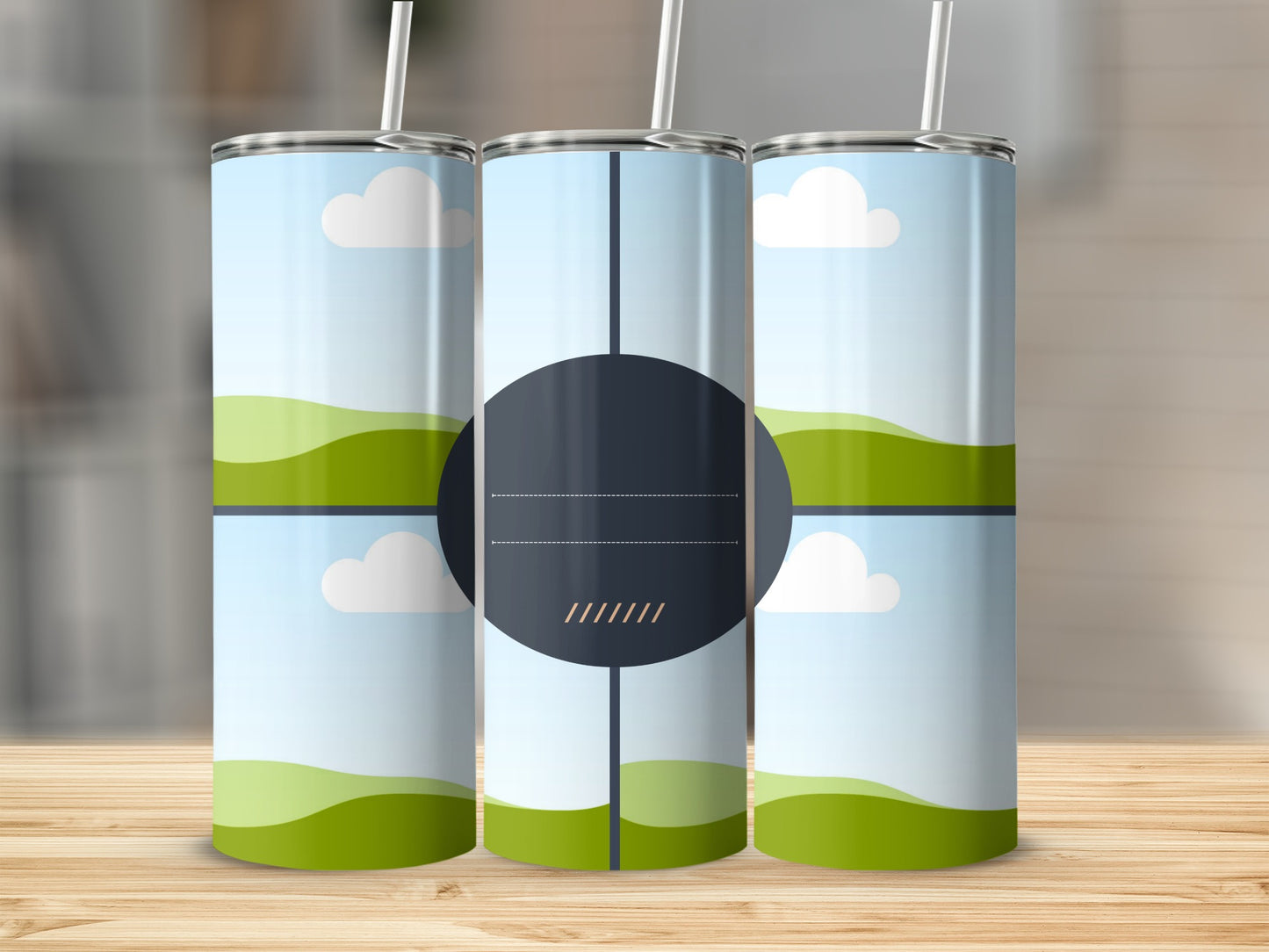 Three tumblers with a landscape design of green hills and white clouds.
