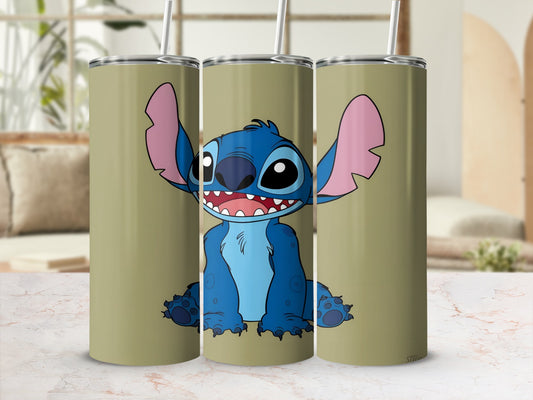 Blue alien character Stitch smiling with open mouth on a tan tumbler.