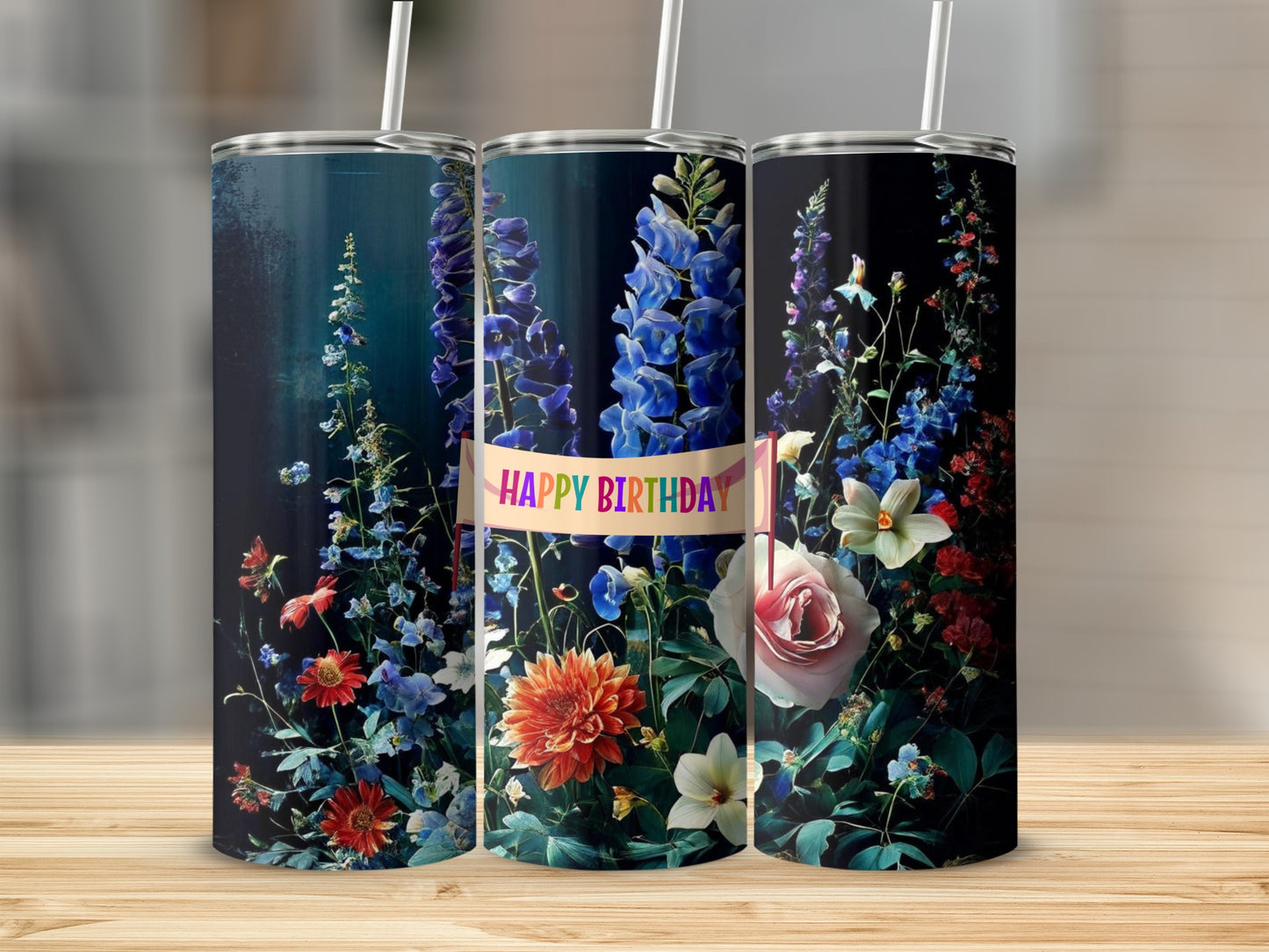 Three tumblers decorated with colorful flowers and "Happy Birthday" text.