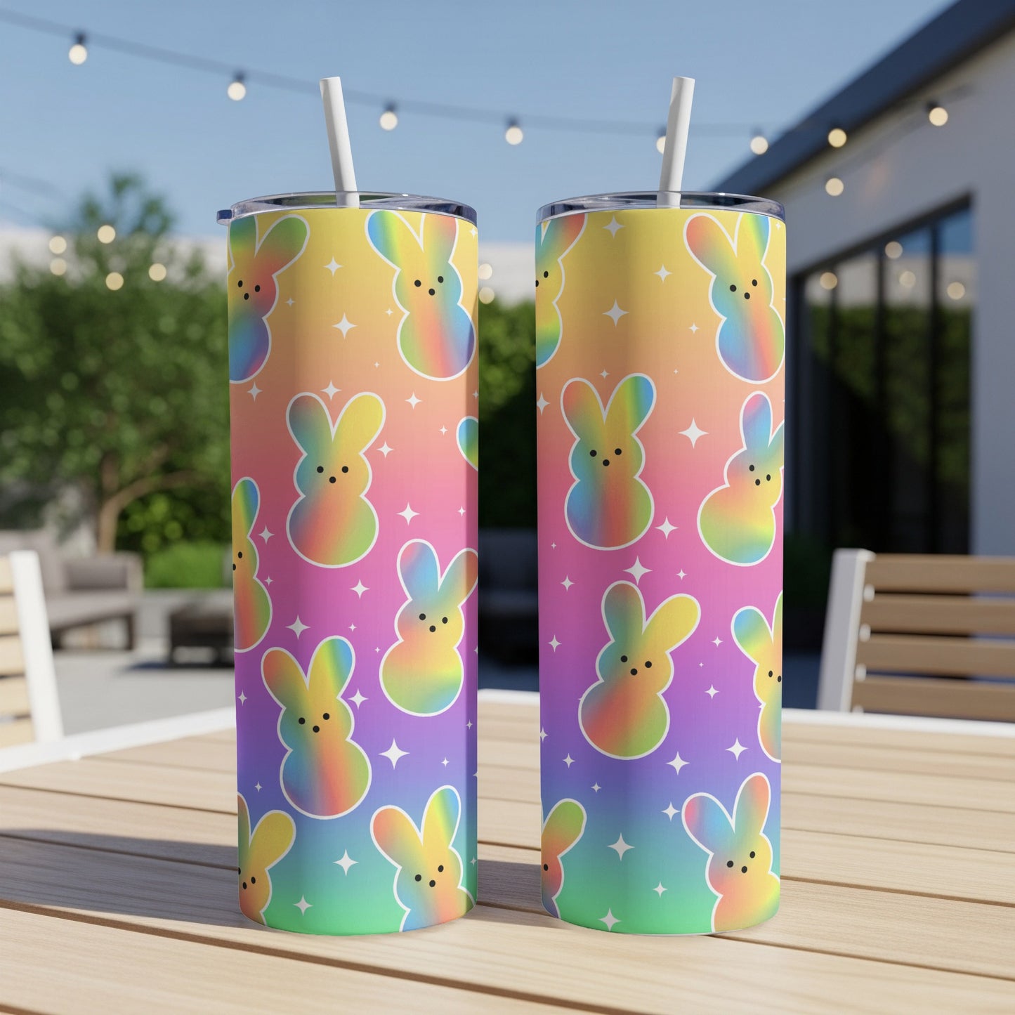 Two tumblers with a colorful rainbow gradient and repeated bunny pattern.