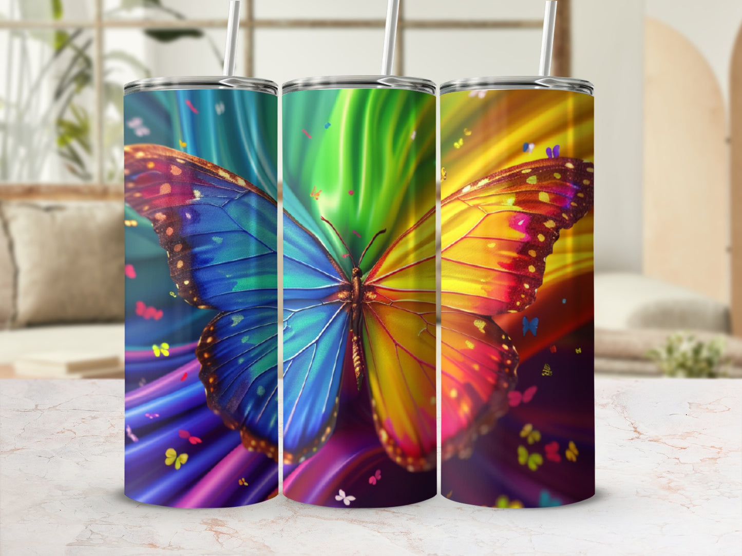 Three tumblers featuring a colorful butterfly design with rainbow streaks.