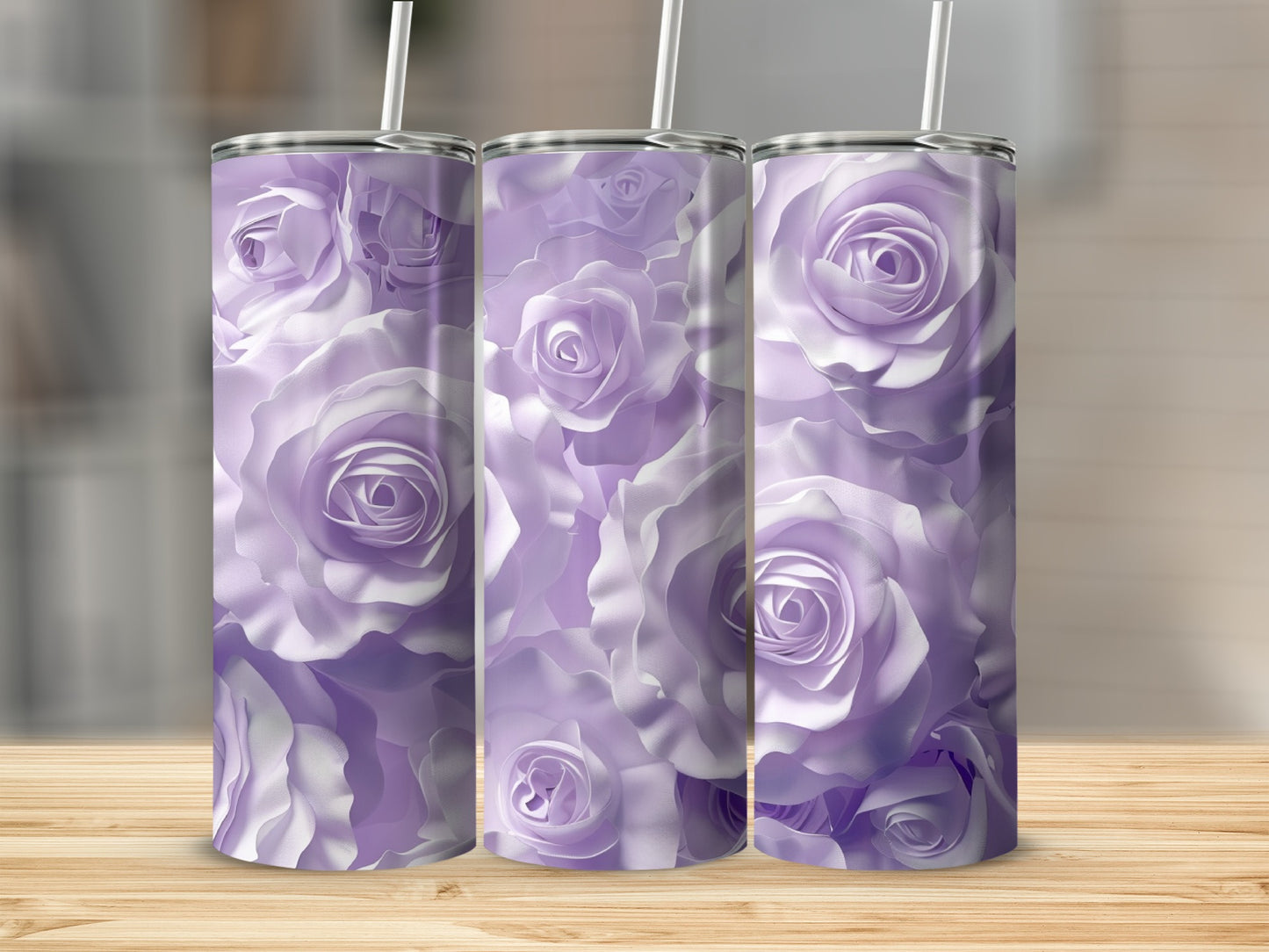 Three tall tumblers with a purple rose pattern on a wooden surface.