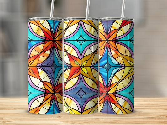 Three tumblers with stained glass pattern on a wooden surface.